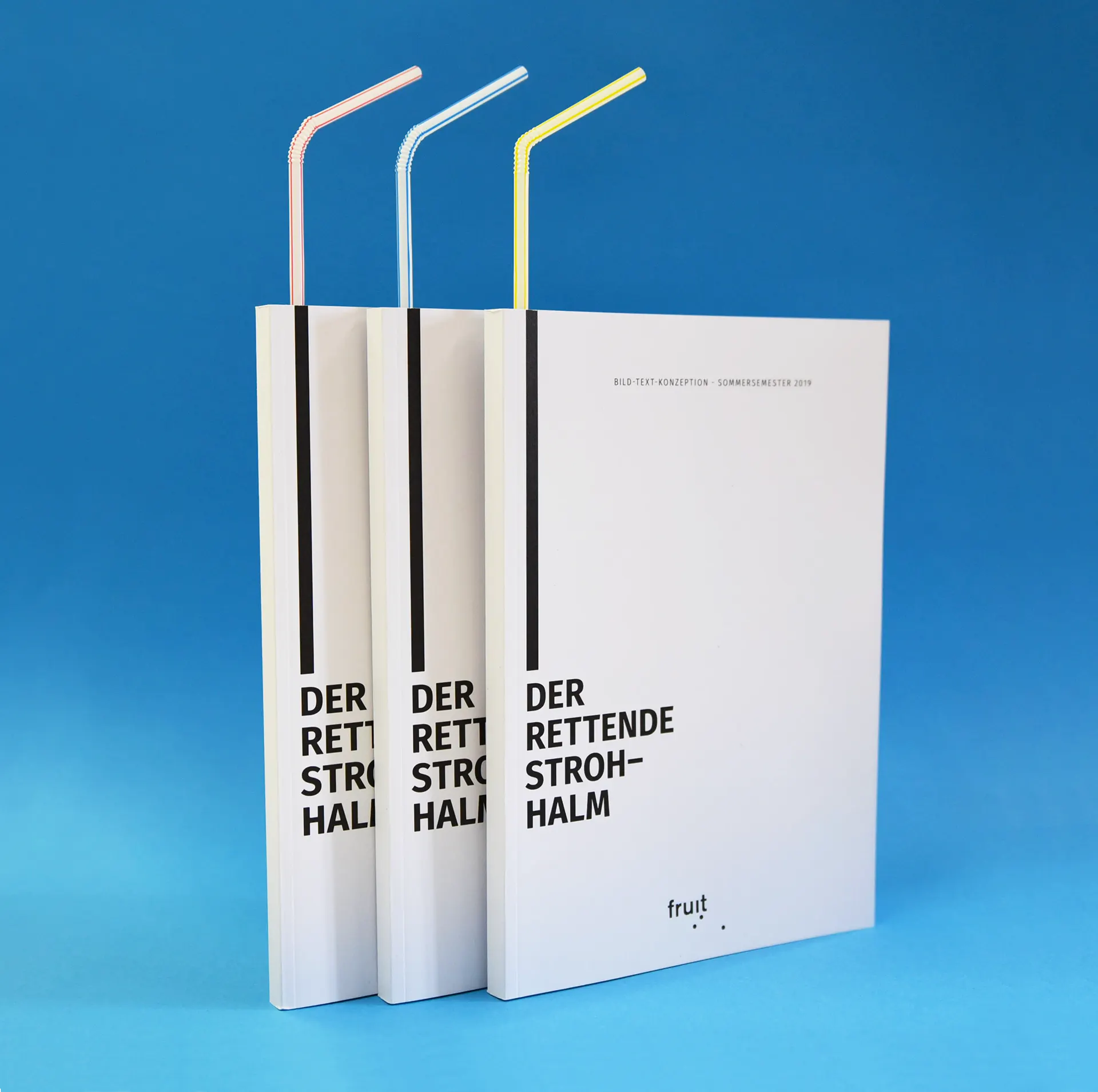 Publications with drinking straws in pink, light blue and yellow against a blue background