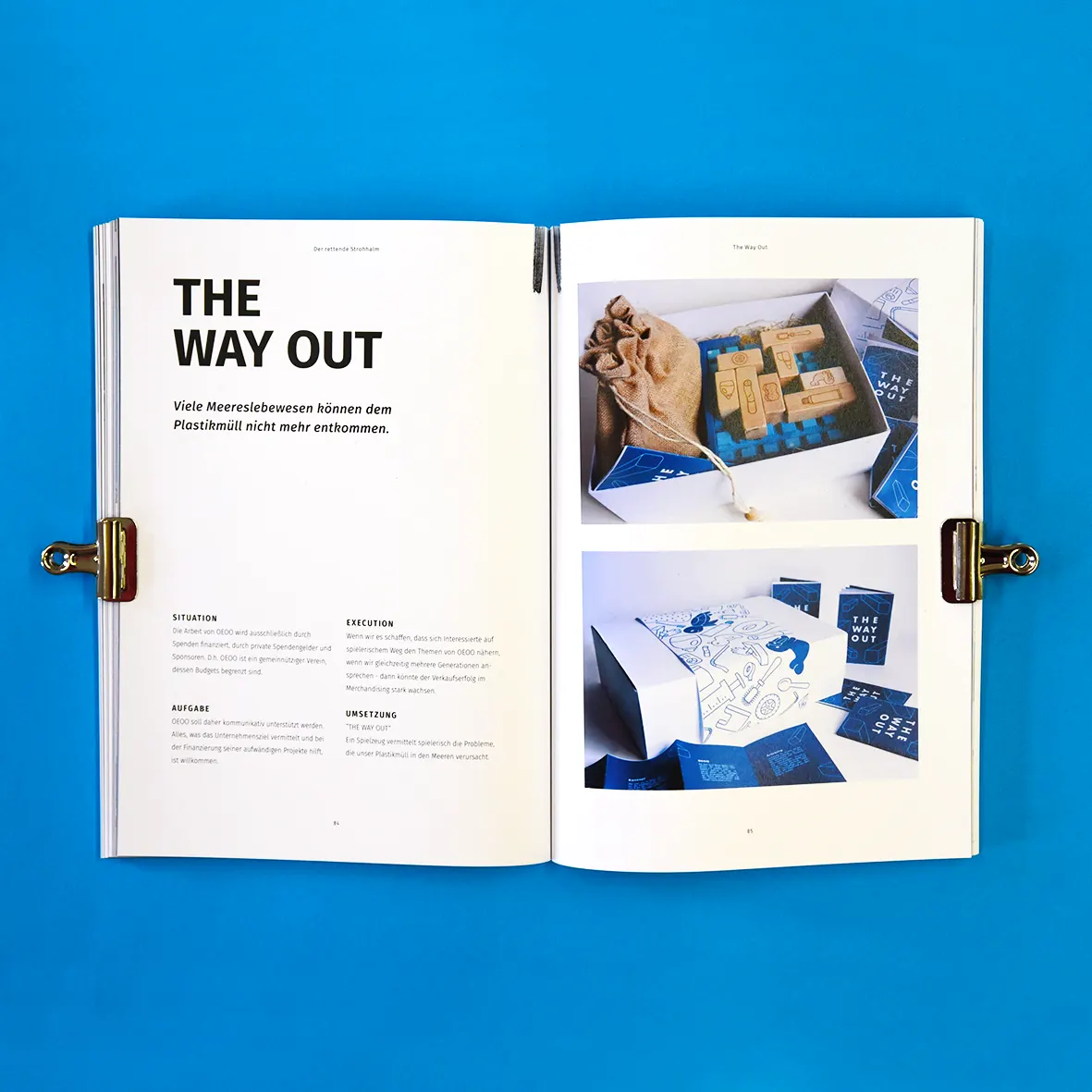 Open spread “The Way Out” with photos of a package, on blue