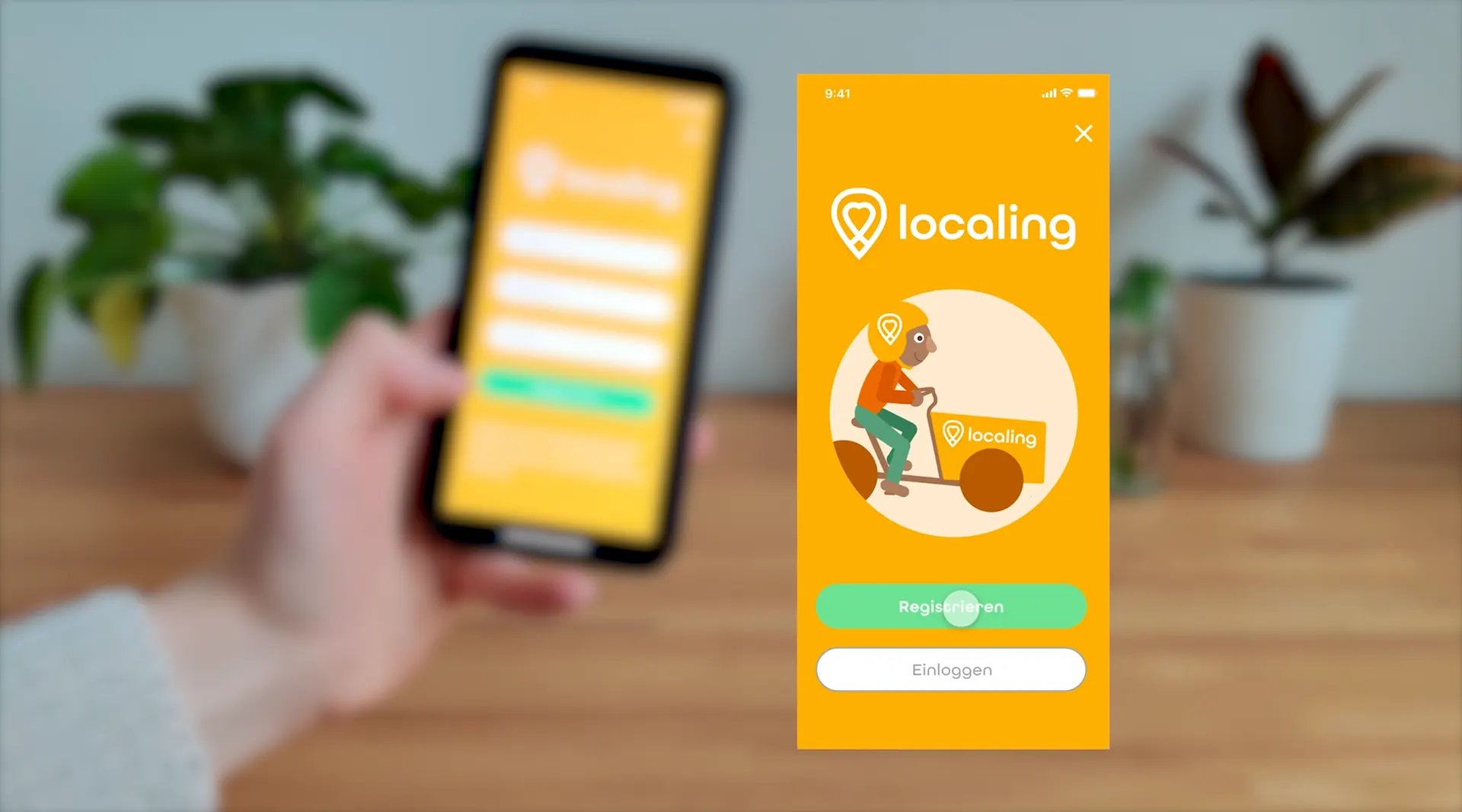 Smartphone with the localing app in front of a blurred background, next to the start screen