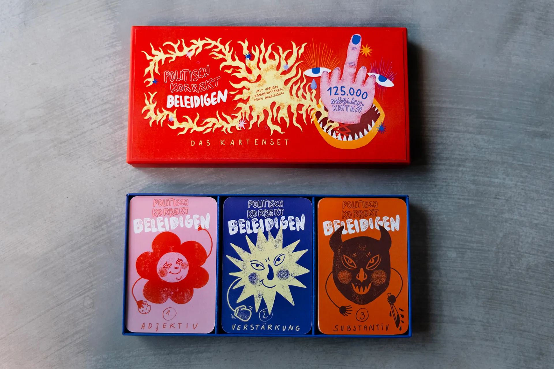 Card set in three boxes with flame, flower and bear motifs
